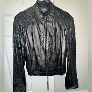 bebe BLK Textured Leather Jacket with embroidered sleeves, snap wrist and zipper